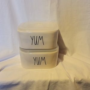 Two Rae Dunn YUM lunch containera